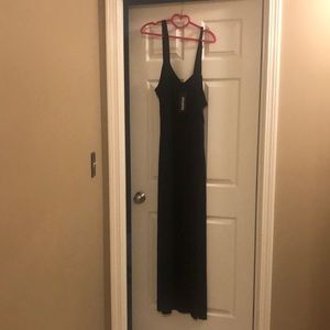 Long black cotton dress with slit.